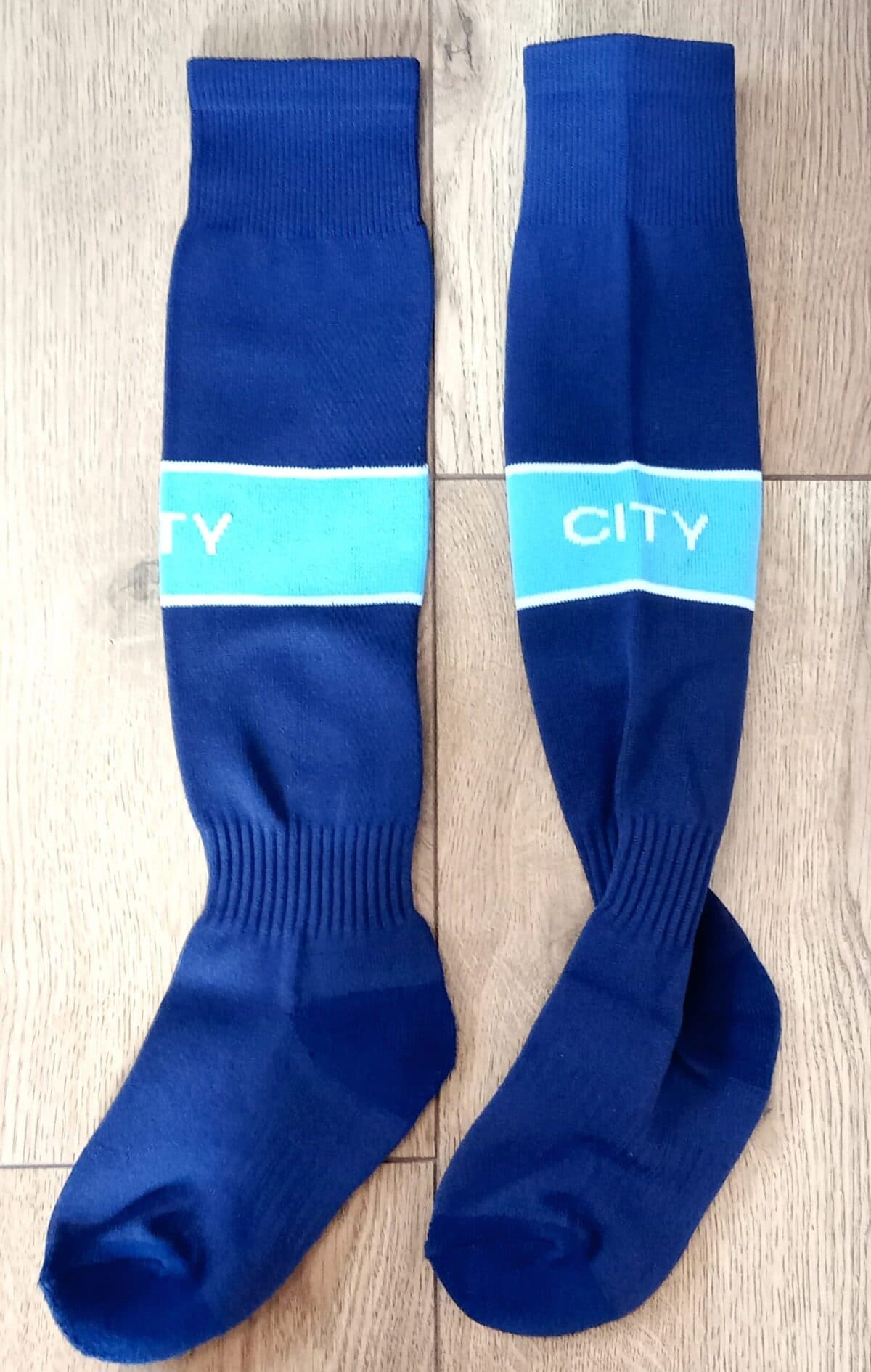 Дитячі футбольні гетри MANCHESTER CITY HOME 2025, темно-сині, розмір 27–35